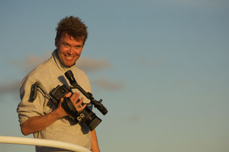 Nick Hope on board the Nai'a shooting humpback whales